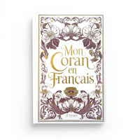 Coran en français expliqué Édition Al Imam, livre blanc et rose avec texte arabe et traduction française.