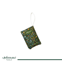 Tapis de prière Nusuki Al-Rawda vert et rouge avec motifs traditionnels, conçu pour le voyage et la prière.