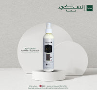 Diffuseur d'ambiance Nusuki Al Haram Freshener en spray textile de 250 ml avec flacon blanc et étiquette verte.