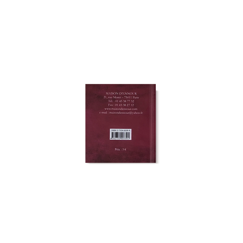 Livre Les 40 Hadîth Qudsî de Maison D'Ennour, couverture avec titre en calligraphie, relié et posé sur une surface.