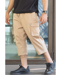 Pantalon sarouel cargo WASSAT pour homme en beige avec poches, style décontracté et confortable.