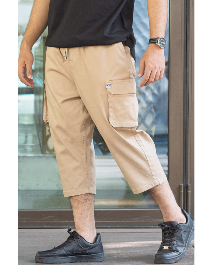 Pantalon sarouel cargo WASSAT pour homme en beige avec poches, style décontracté et confortable.