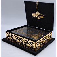 Coffret Coran luxe Sana Edition en noir doré avec Coran AR/FR, design élégant, couverture noire et dorée.