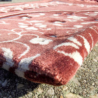 Tapis de prière Sana Edition avec motif jardin, couleur terracotta, décoratif et confortable pour la prière.