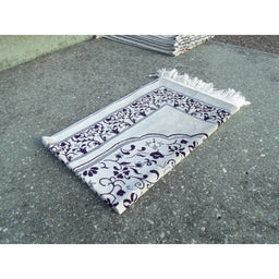 Tapis de prière Sana Edition avec motif Jardin, fond blanc et détails violets, idéal pour la prière.