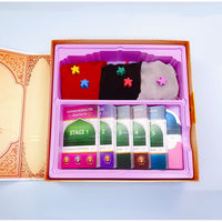 Jeu de société éducatif Hassanates Village par SanaKids, pour enfants et adultes, avec plateau coloré et pièces de jeu.