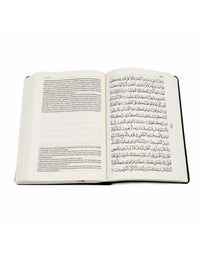 Coran Tawbah avec traduction arabe-français, livre de l'édition Tawbah, pages ouvertes montrant le texte en arabe et français.